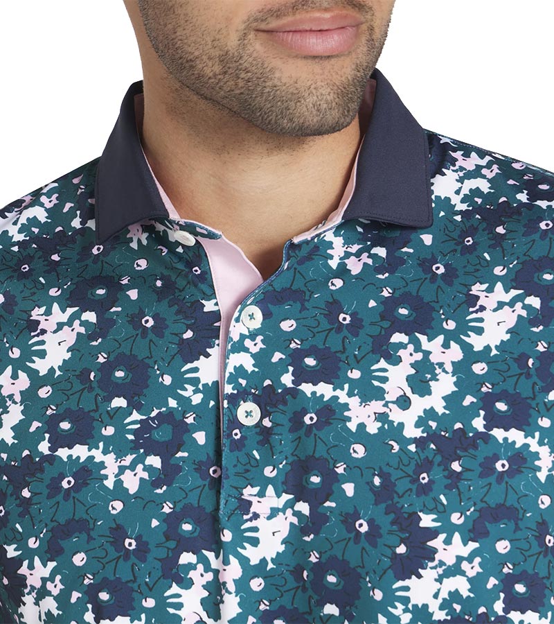 Puma Mens AP Floral Golf Polo Shirt closeup of collar in Cold Green with a vibrant all-over abstract floral. The collar is a solid coordinating color with a lighter contrast color for the inner collar and the 3 button inner placket.