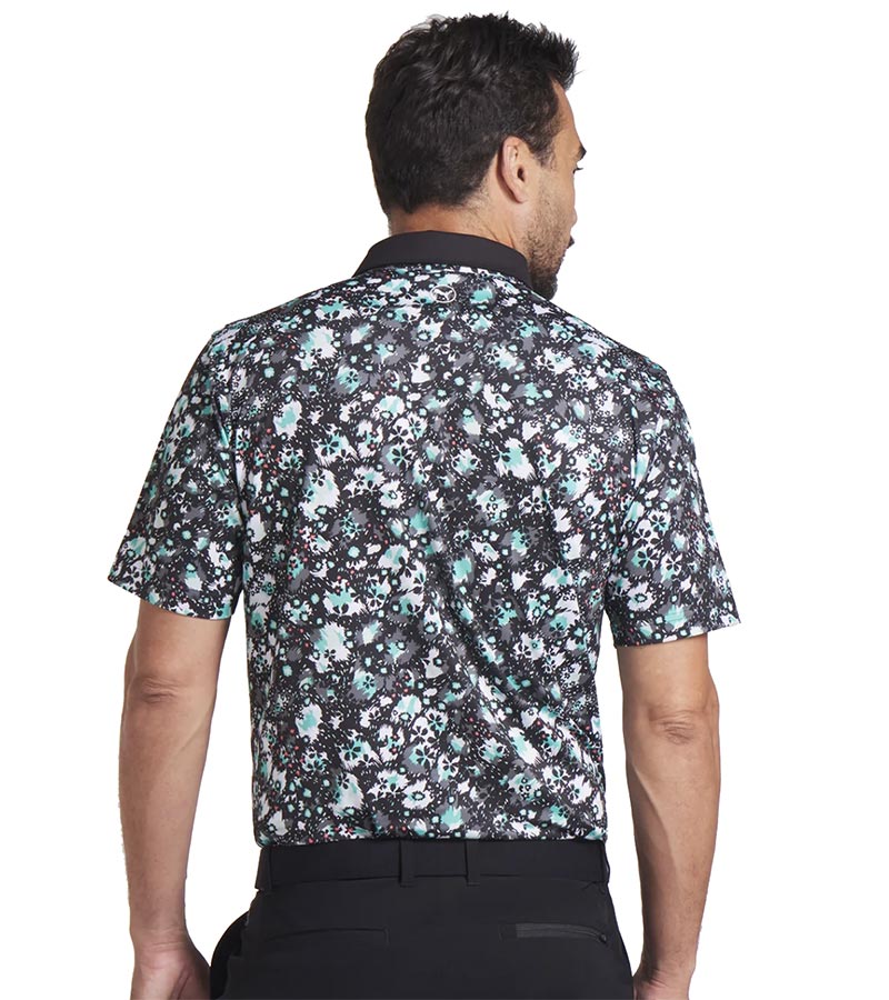 Puma Mens CLOUDSPUN Abstract Camo Golf Polo Shirt Model Back in Puma Black / Aquatic with an all over abstract floral camo pattern with a black collar and pink coral accent on the inner collar and 3 button placket.