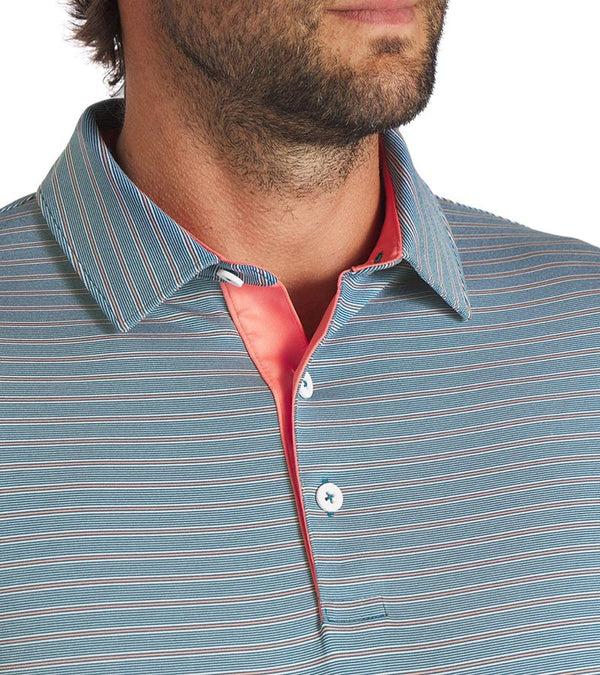 Puma Mens MATTR Bay Golf Polo closeup of collar in Ocean Tropic with simple thin stripes in different colors and contrast button placket lining at the collar.