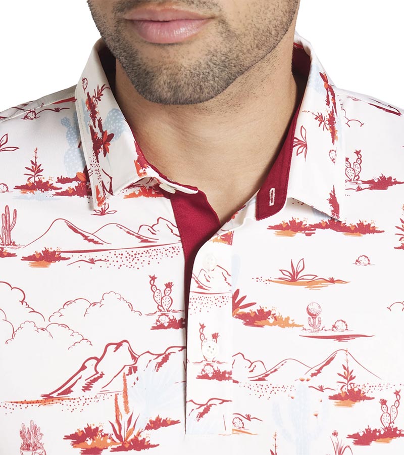 Puma Mens MATTR Bushland Golf Polo closeup of collar in Warm White / Silver Skywith a print of sketched outlines of desert plants, cactus, mountains, and clouds. Contrasting color on the inside of the button placket.