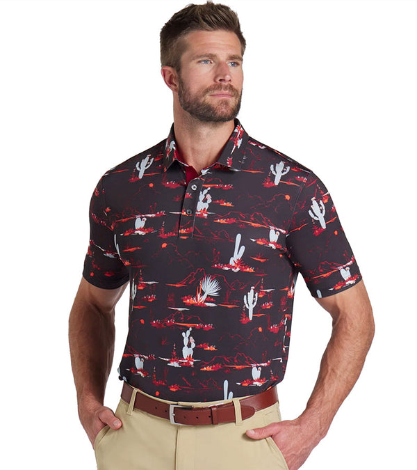 Puma Mens MATTR Bushland Golf Polo Model Front in Puma Black / Intense Redwith a print of sketched outlines of desert plants, cactus, mountains, and clouds. Contrasting color on the inside of the button placket.