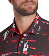 Puma Mens MATTR Bushland Golf Polo Model closeup of collar in Puma Black / Intense Redwith a print of sketched outlines of desert plants, cactus, mountains, and clouds. Contrasting color on the inside of the button placket.