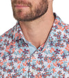 Puma Mens MATTR Lillie Golf Polo shirt closeup of collar in Redmazing / Silver Sky with a little lilies all-over floral print.