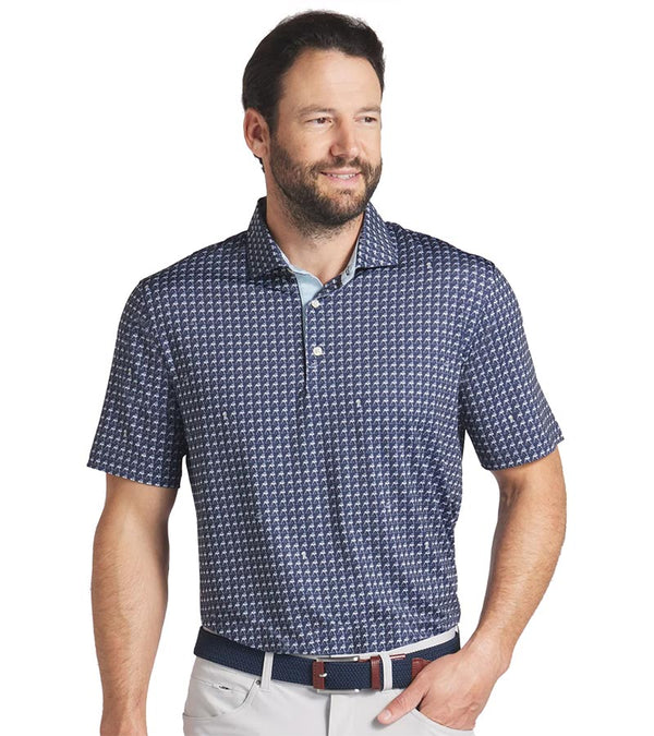 Puma Mens MATTR Pup Golf Polo Shirt Model Front in Deep Navy / Silver Sky with a tiny set pattern of stylized pups with a coordinating color on the inside of the collar and 3 button placket.