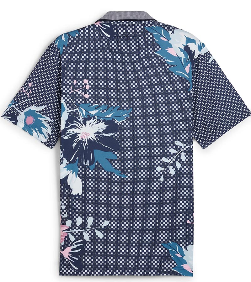 Puma Mens MATTR Terrance Golf Polo Shirt -back- in Deep Navy with a widely spaced group of tropical flowers & leaves on a small set geometric navy background.