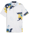 Puma Mens MATTR Terrance Golf Polo Shirt front in Silver Sky with a widely spaced group of tropical flowers & leaves on a small set geometric white on white background.