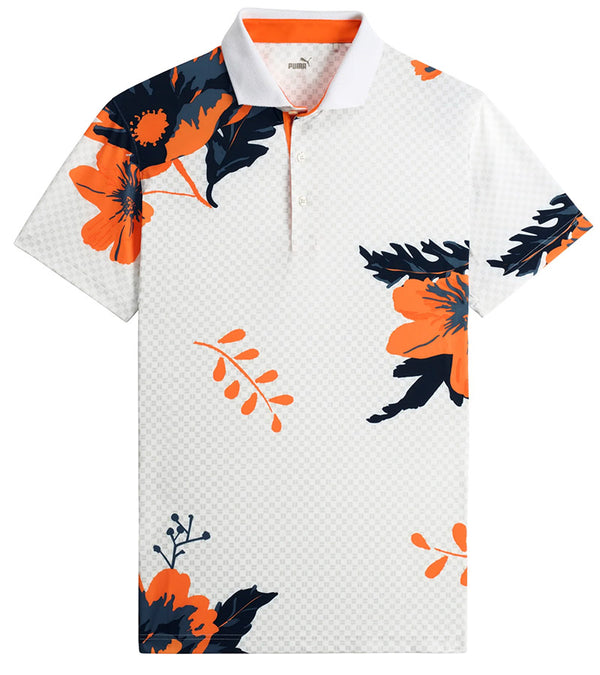 Puma Mens MATTR Terrance Golf Polo Shirt -front- in White Glow / Rickie Orangewith a widely spaced group of tropical flowers & leaves on a small set geometric white on white background.