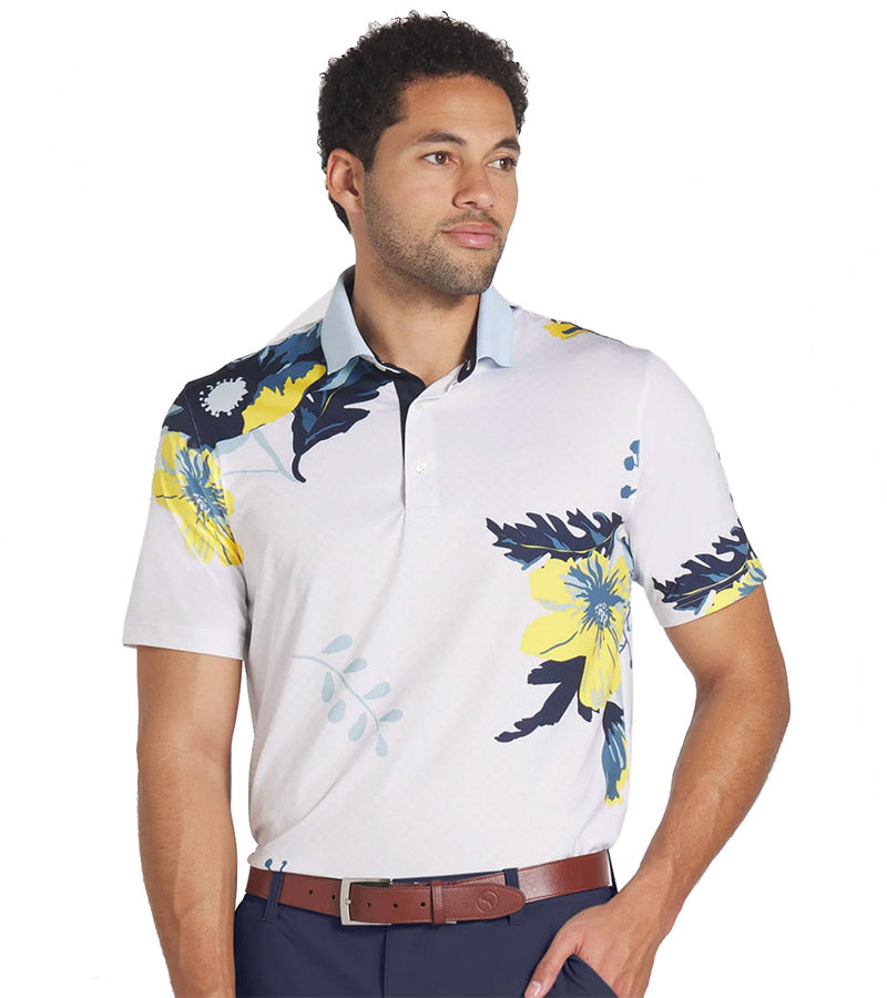 Puma Mens MATTR Terrance Golf Polo Shirt Model Front in Silver Sky with a widely spaced group of tropical flowers & leaves on a small set geometric white on white background.