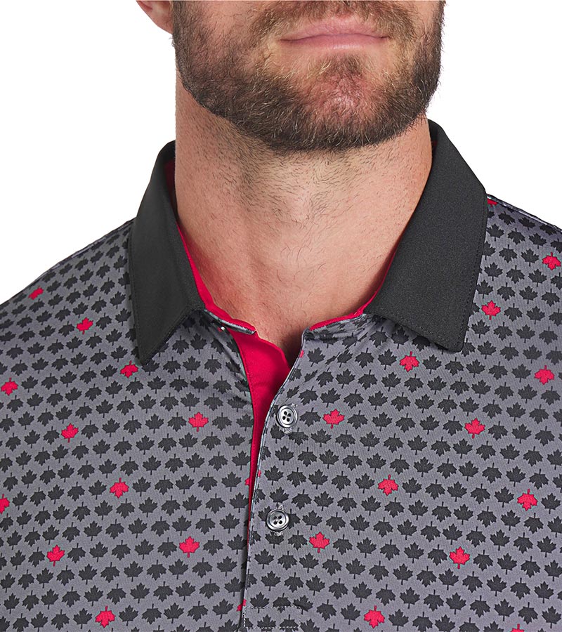 Puma Mens Canada Maple AOP Golf Polo Shirt closeup of collar Back in Puma Black / Strong Red with a set design of small black maple leaves with evenly spaced red maple leaves. The inner collar and 3 button placket are red adding a stylish accent against the black collar.