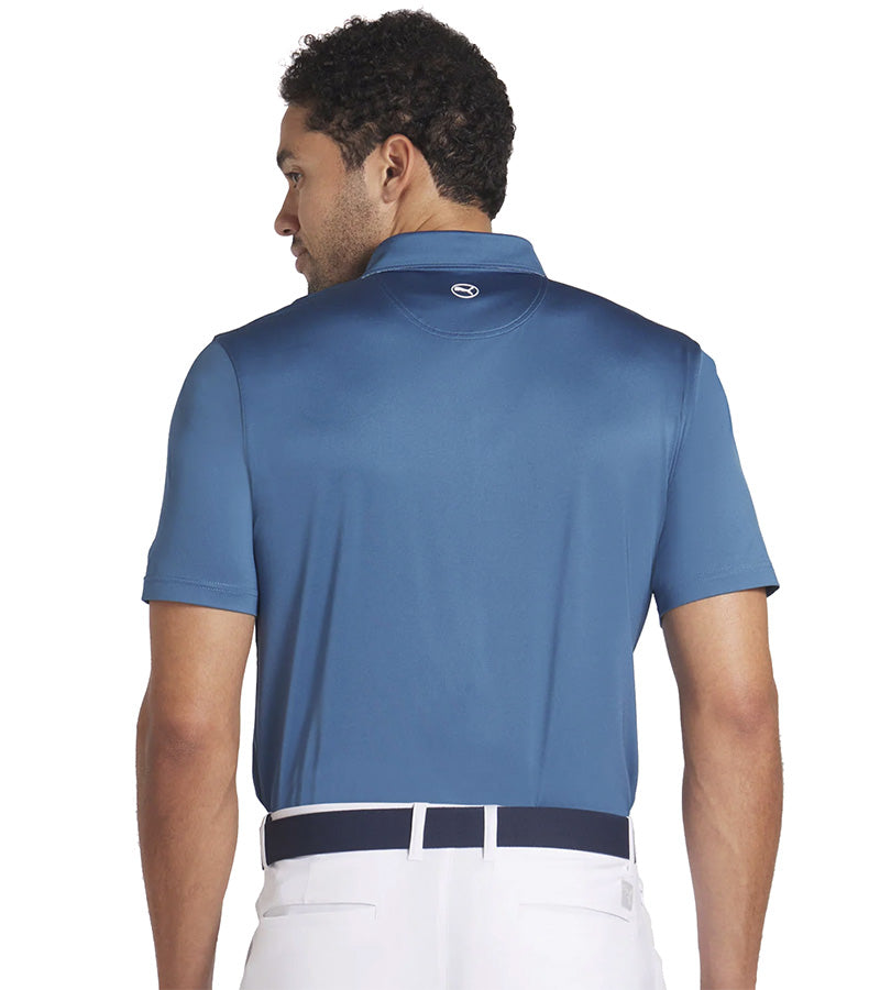 Puma Mens Fair Isle Trim Golf Polo Shirt Model -back in solid Blue Horizon with the geometric print from the Fair Isle Micro golf polo lining the entire inner and under section of the collar and 3 button placket for a distinctive accent to the shirt.