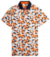 Puma Mens Pique Borrego Golf Polo Shirt front in White Glow / Rickie Orange has a contemporary all-over floral pattern. The black collar with vibrant inner collar color of orange and 3 button inner placket in orange add a pop of coordinated color elevating the overall look.