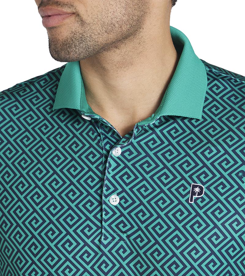 Puma Mens x PTC Resort Golf Polo Shirt closeup of collar in Deep Navy / Sparkling Green has an all-over Greek key design, a Sparkling Green collar with a solid coordinated Sparkling Green color on the inner collar and a 3 button placket.