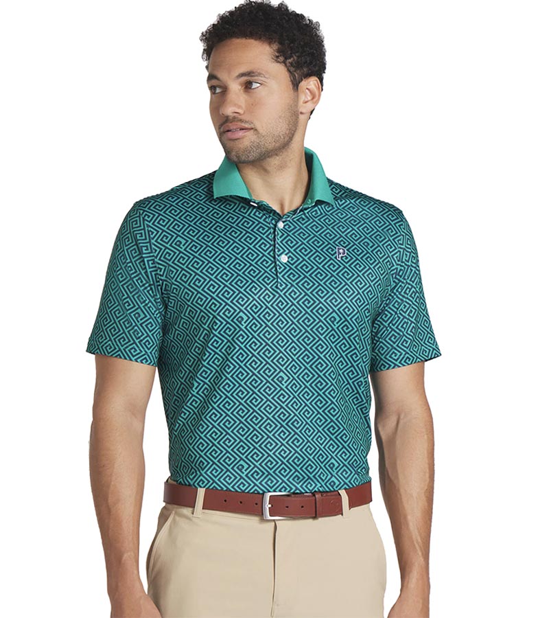 Puma Mens x PTC Resort Golf Polo Shirt Model - front in Deep Navy / Sparkling Green has an all-over Greek key design, a Sparkling Green collar with a solid coordinated Sparkling Green color on the inner collar and a 3 button placket. 
