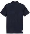 Puma x PTC Jacquard Golf Polo Shirt - back in Deep Navy has large palm fronds widely spaced in a subtle monochromatic jacquard weave, a classis polo collar, and a 3 button placket.