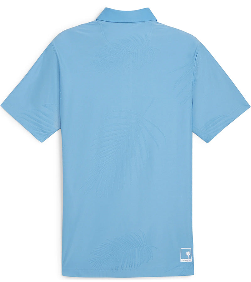 Puma x PTC Jacquard Golf Polo Shirt - back in Regal Blue has large palm fronds widely spaced in a subtle monochromatic jacquard weave, a classis polo collar, and a 3 button placket.