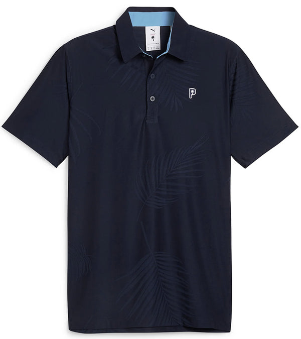 Puma x PTC Jacquard Golf Polo Shirt - front in Deep Navy has large palm fronds widely spaced in a subtle monochromatic jacquard weave, a classis polo collar, and a 3 button placket.