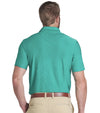 Puma x PTC Jacquard Golf Polo Shirt Model - back in Sparkling Green has large palm fronds widely spaced in a subtle monochromatic jacquard weave, a classis polo collar, and a 3 button placket