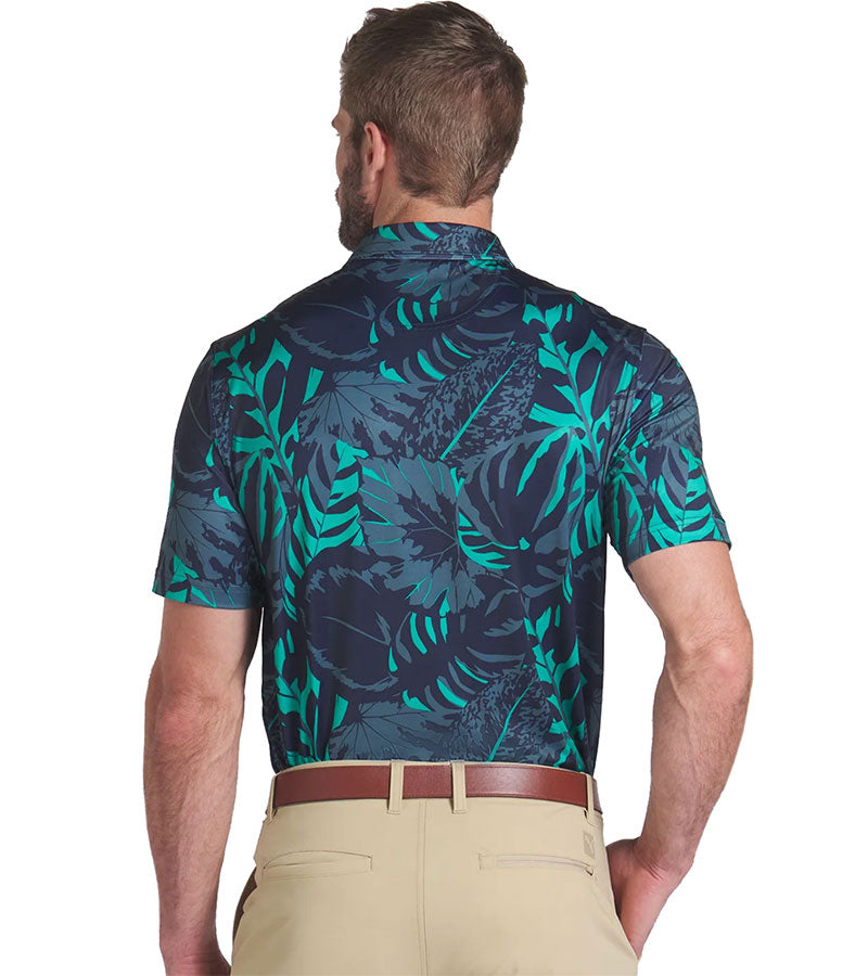 Puma Mens x PTC Palm Glitch Golf Polo Shirt Model - back in Deep Navy / Sparkling Green has an all over pattern of large lush palm fronds, a classis polo collar, and a 3 button placket.