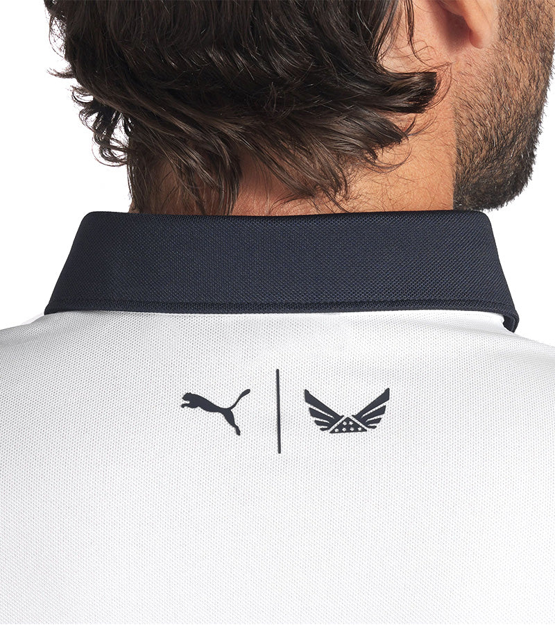 Puma Mens Volition Eagle Golf Polo Shirt closeup of collar back of shirt- in White Glow / Deep Navy with Puma’s logo and Volition America’s emblem on the back collar highlighting the collaboration and commitment to honoring heroes.