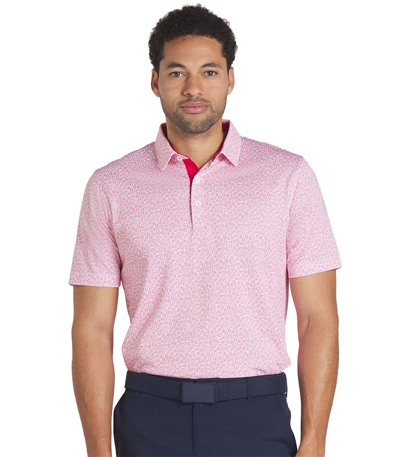 Puma Mens Volition Football Golf Polo Shirt Model Front in Strong Red / White Glow  with an all over small tossed footballs. The red accent color of the inner collar and 3 button placket gives a pop to the all over look.