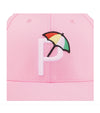 Puma Palmer P Golf Cap in Pale Pink / White Glow with closeup of the Palmer P logo with a colorful golf umbrella