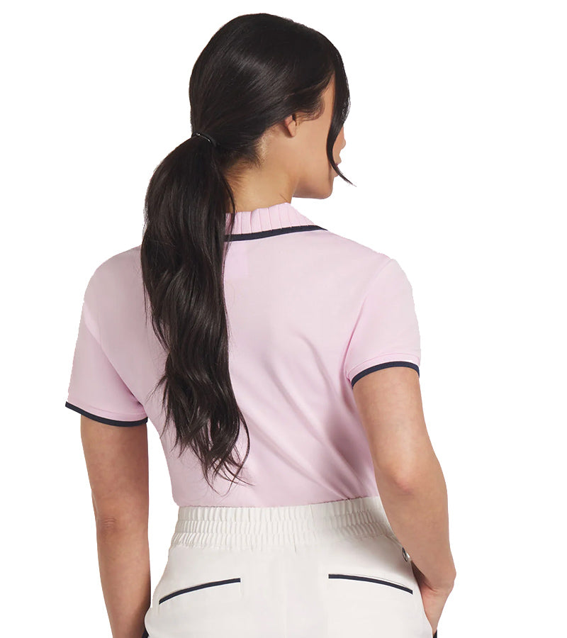 Puma Womens Pique Borrego Sleeveless Golf Polo Shirt - model back in solid Pale Pink featuring a classic ribbed collar with dark navy contrast piping and a five-button inner placket.