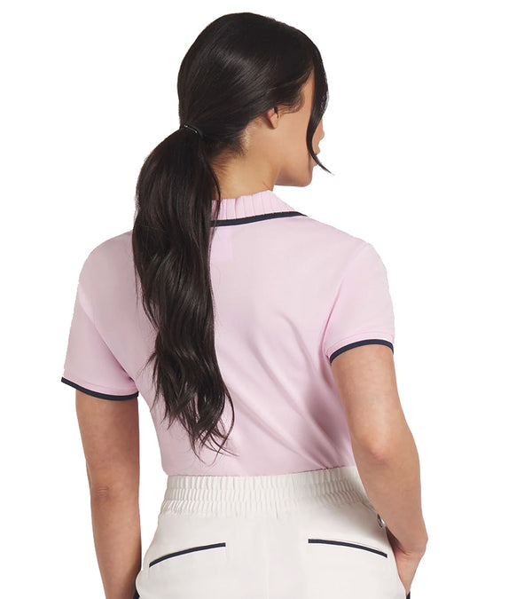 Puma Womens Pique Borrego Sleeveless Golf Polo Shirt - model back in solid Pale Pink featuring a classic ribbed collar with dark navy contrast piping and a five-button inner placket.