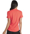 Puma Womens CLOUDSPUN Piped Golf Polo Shirt / Short Sleeve - model back in solid Active Red. With a classic collar, the golf shirt’s standout feature is its piped detailing at the V neckline adding a touch of sophistication to the overall design.