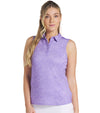 Puma Womens MATTR Hadley Sleeveless Golf Polo Shirt model front in Lavender Alert featuring a delicate tiny white floral & dots print with a classic polo collar and 5 button placket for a sophisticated, sporty look. 