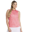 Puma Womens MATTR Hadley Sleeveless Golf Polo Shirt model front in Salmon featuring a delicate tiny white floral & dots print with a classic polo collar and 5 button placket for a sophisticated, sporty look. 