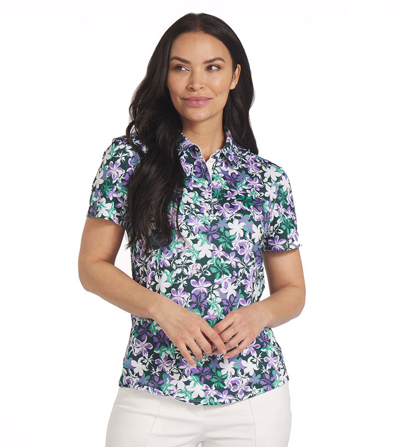 Puma Womens MATTR Lillie Golf Polo Shirt model front in Dark Myrtle / Lavender Alert featuring an all over smallish floral print with a classic polo collar and button placket for a sophisticated, sporty look. 