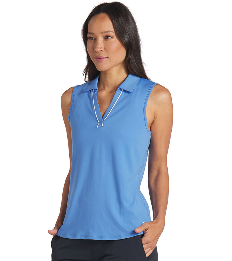 Puma Womens CLOUDSPUN Piped Sleeveless Golf Polo Shirt- model front in solid Blue Skies. With a classic collar, the golf shirt’s standout feature is its piped detailing at the V neckline adding a touch of sophistication to the overall design.