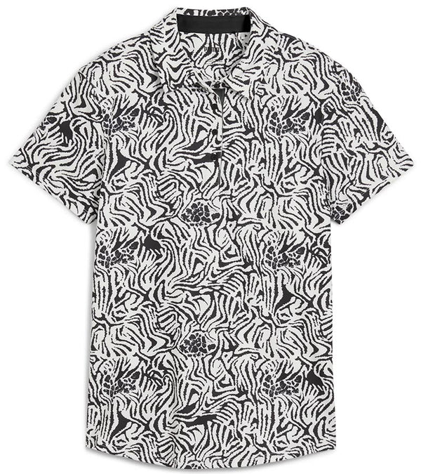 Puma Womens CLOUDSPUN Zebra Golf Polo Shirt front in Warm White / Puma Black featuring a bold all-over zebra pattern with a coordinating solid accent color for the inner collar and inner button placket.