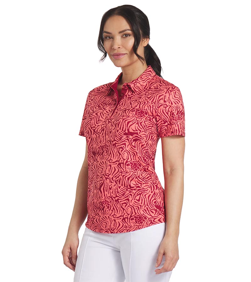 Puma Womens CLOUDSPUN Zebra Golf Polo Shirt model front in Salmon / Intense Red featuring a bold all over zebra pattern with a coordinating solid accent color for the inner collar and inner button placket.