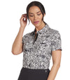 Puma Womens CLOUDSPUN Zebra Golf Polo Shirt model front in Warm White / Puma Black featuring a bold all over zebra pattern with a coordinating solid accent color for the inner collar and inner button placket.