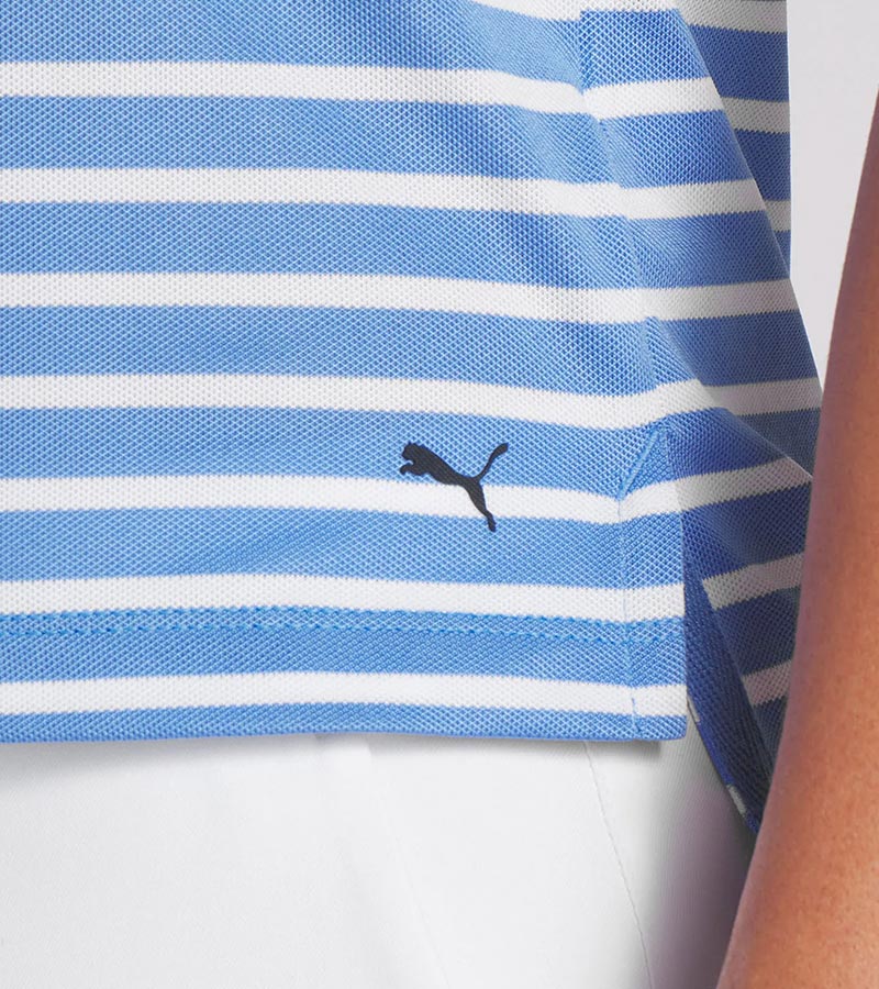 Puma Womens Everyday Stripe Pique Golf Polo Shirt in striped Blue Skies / White Glow with a closeup of tthe cat logo.