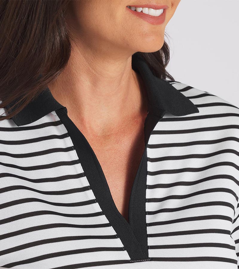 Puma Womens Everyday Stripe Pique Golf Polo Shirt in striped White Glow / Puma Black with a closeup of the neckline featuring black piped detailing at the V neckline, a black classic collar and black banded short sleeves adding a touch of sophistication to the overall design.