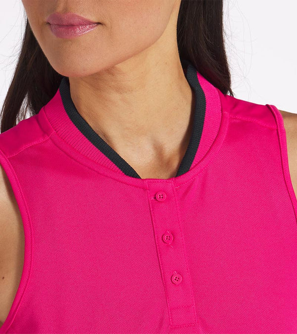 PUMA Women's Range Pique Sleeveless Golf Polo shirt model front in solid Garnet Rose with closeup of neckline featuring a ribbed collar with black contrast piping and a three-button placket.