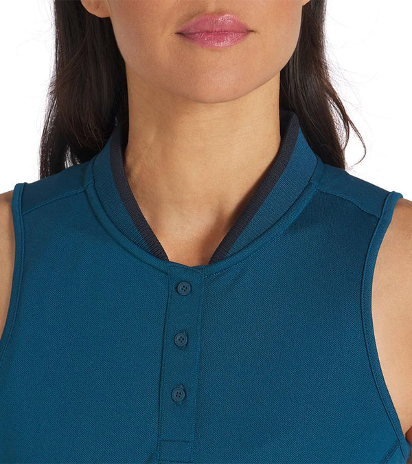 PUMA Women's Range Pique Sleeveless Golf Polo shirt in solid Ocean Tropic with closeup of neckline featuring a ribbed collar with black contrast piping and a three-button placket.