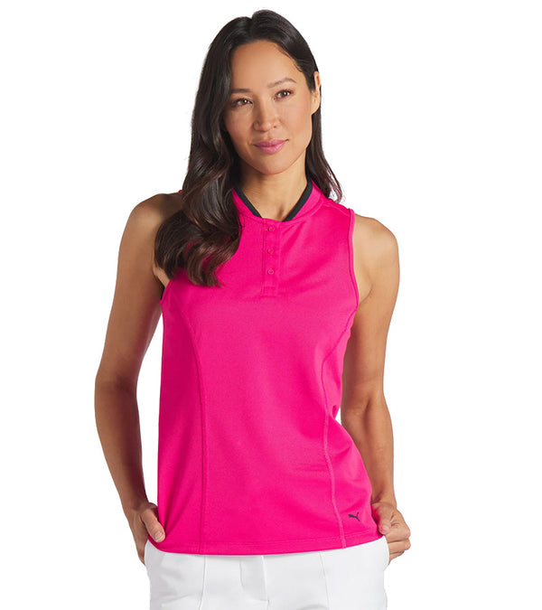 PUMA Women's Range Pique Sleeveless Golf Polo shirt model front in solid Garnet Rose with model front featuring a ribbed collar with black contrast piping and a three-button placket.