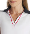 Puma Womens Volition Piped Sleeveless Golf Polo closeup of neckline in White Glow features a classic sleeveless design with distinctive contrast details with a contrasting collar and signature red piping along the V-neck placket.