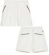 Puma x AP Solid Women’s Golf Shorts- front & back in Warm White with contrast navy piping on the pockets 