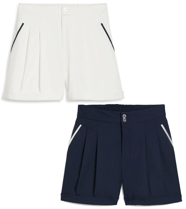 Puma x AP Solid Women’s Golf Shorts- front in Warm White and Deep Navy with contrast piping on the pockets.