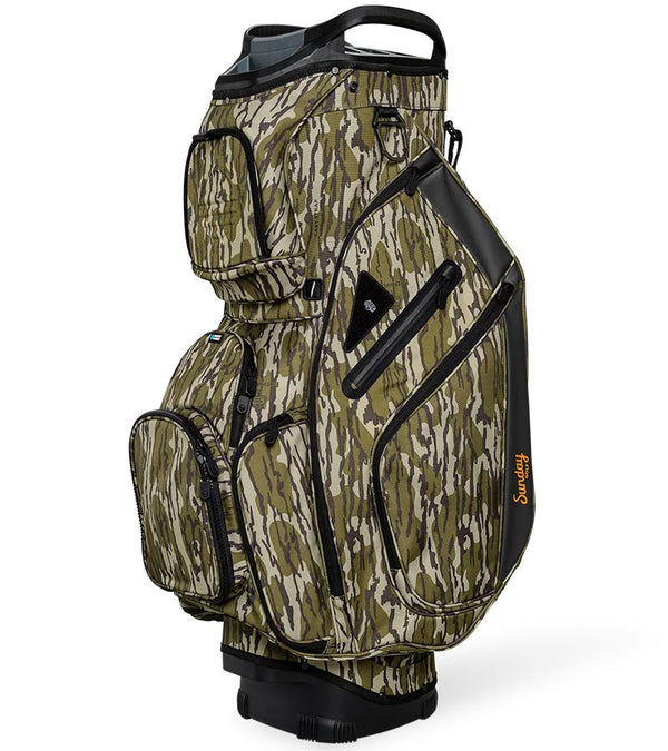 Sunday Golf The Big Rig Golf Cart Bag in Mossy Oak Bottomland Camo with black accents on details  like zippers, base and top club divider showing a three quarter front/side view