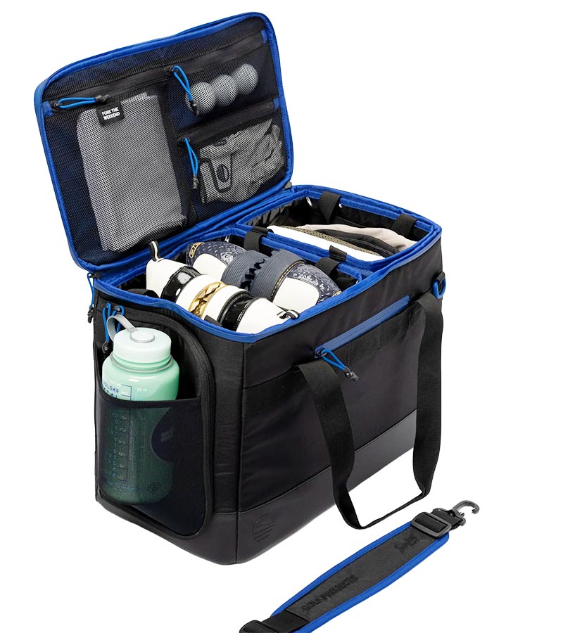 Sunday Golf Creator Duffle Bag in Black with blue accent details shows its organized compartments and padded shoulder strap.