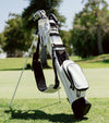 Sunday Golf Loma Golf Bag S-Class with legs extended on the fairway in White