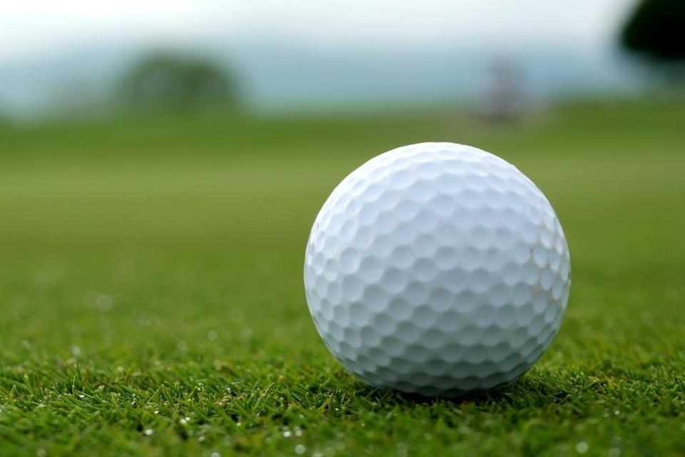 golf ball on golf course close up