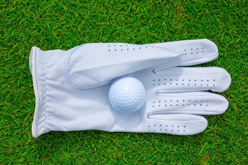 clean golf glove with ball on it