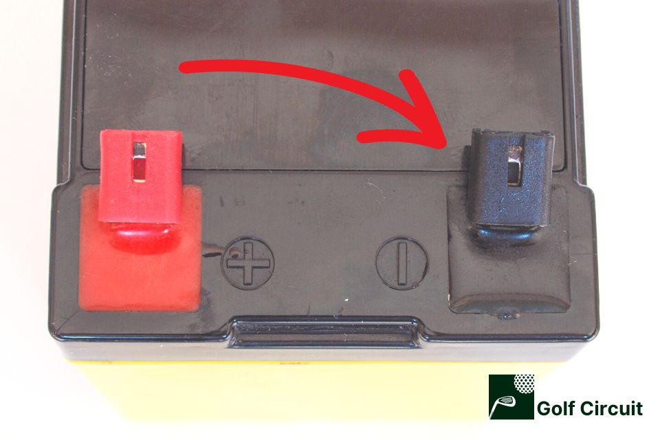 Showing where the negative terminal is on a golf cart battery