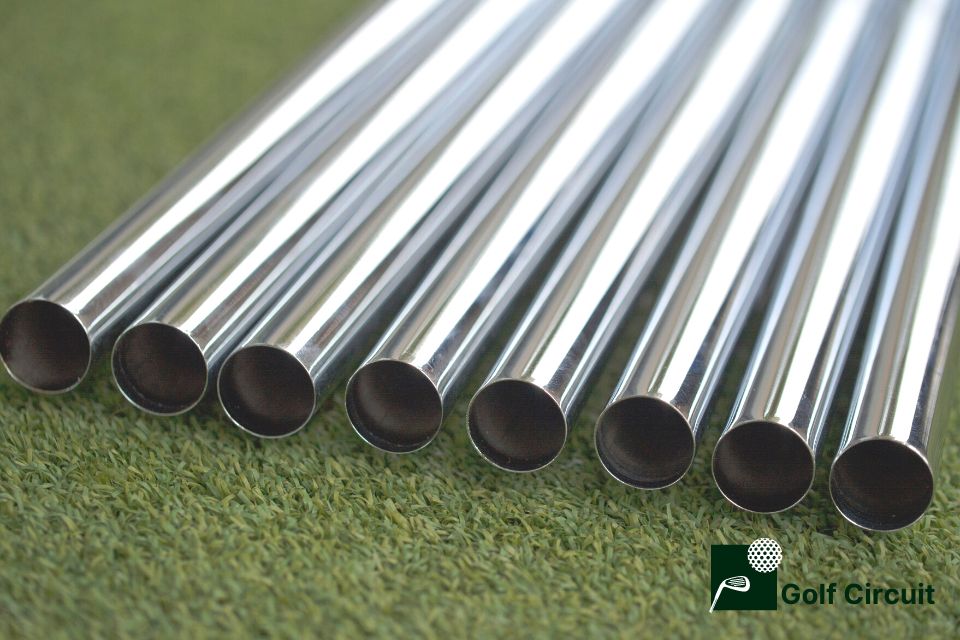 Graphite shafts laying on grass